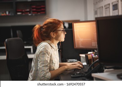 Female Programmer Working Working Late At Night In Her Office.	
