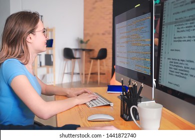 Female Programmer Working In Office