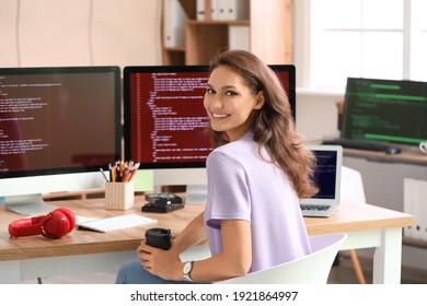 Female Programmer Working In Office