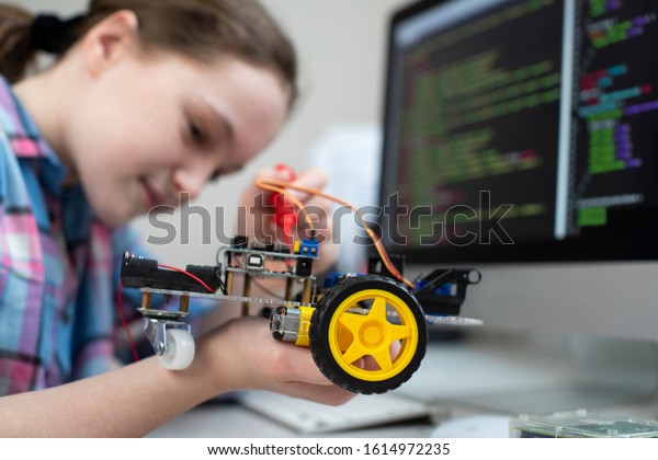 Female\
Pupil Building Robot Car In School Science\
Lesson