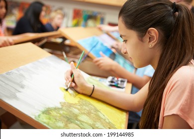 Female Pupil In High School Art Class