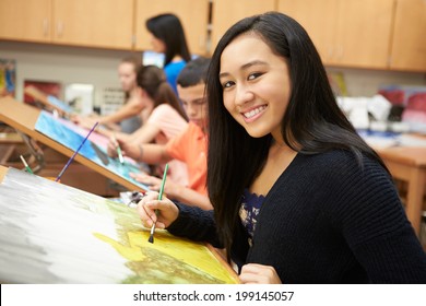 Female Pupil In High School Art Class