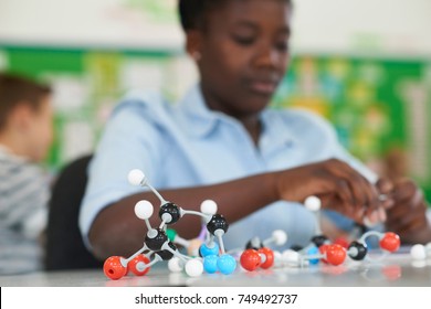 Female Pupil Using Molecular Model Kit In Science Lesson - Powered by Shutterstock