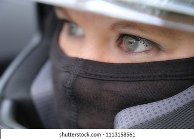 Female Race Car Driver Wearing Helmet And Balaclava