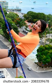 A Female Rappellist Descending The Elevator Lacerates. Very Tall Monument. Salvador Bahia Brazil.