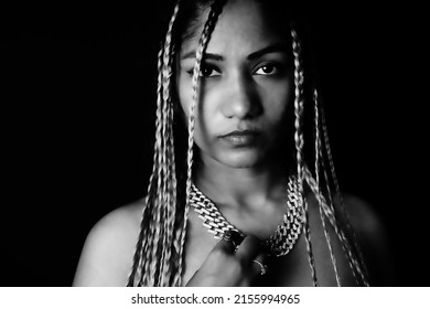 Female Rapper Wearing Necklace Over Black Background