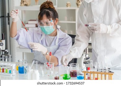 Female Research Scientist Sat With A Blood Test Tube For An Examination Of The Treatment Of Covid 19 At A Hospital Laboratory.Healthcare And Research Concept.