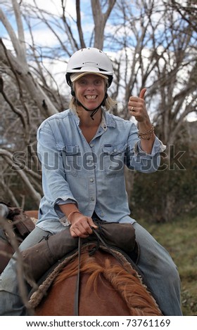 female rider with horse in the outback