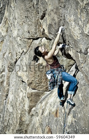 Similar – Rock climber clinging to a cliff.