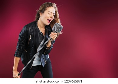 Female Rockstar Singing With Retro Vintage Microphone