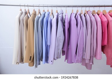 Female Row Of Formal Business Different  Colorful Suit, Jacket ,sweater,shirt With Hoodies And Sweatshirts Isolated On Hanger-white  Background
