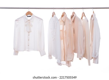 female row of suit,blouses ,white shirt  on hanger - Shutterstock ID 2217505549
