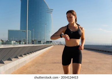 Female Runner Checking Smart Watch