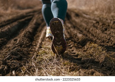 Female Runner Jogging Down An Outdoor Trail At Sunset. New Start Of The New Year 2023, Goals And Plans For The Next Year. Starting To New Year