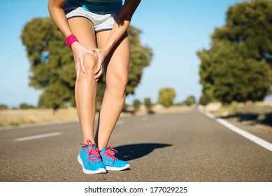 Female Runner Knee Injury And Pain.