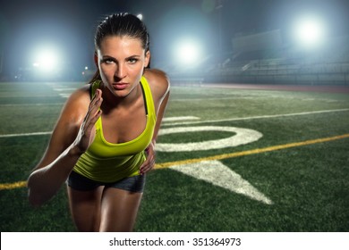 Female Runner Sprinter Exercising And Training Intense Track And Football Field Athlete Determination For Greatness In Sports