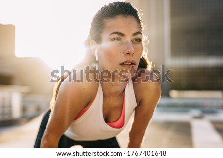 Similar – Image, Stock Photo Runner woman relaxed listening to music for training outdoors