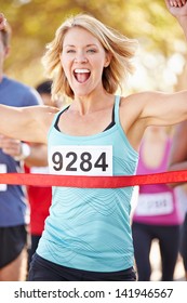 Female Runner Winning Marathon