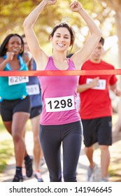 Female Runner Winning Marathon