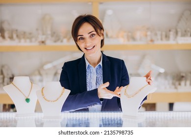 Female sales person at jewelry shop - Powered by Shutterstock