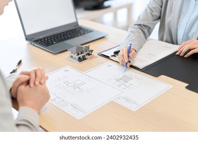 Female salesperson providing real estate information