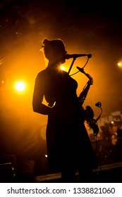 Female Saxophone Player On A Live Stage