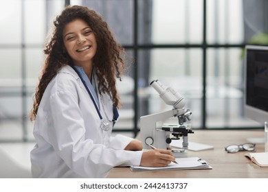 Female scientist researcher conducting an experiment in a labora - Powered by Shutterstock