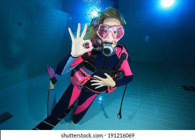 Female Scuba Diver Smiling Underwater In The Pool