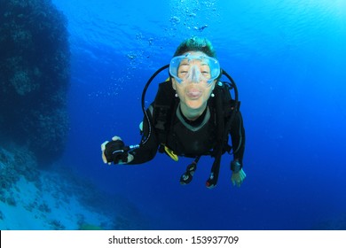 Female Scuba Diver Underwater Having Fun