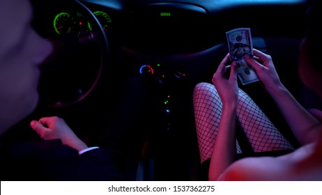 Female In Seductive Clothing Counting Money In Car, Prostitution Services