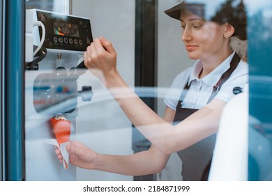 A Female Seller Holds A Cone With A Twisted Ice Cream From A Vending Machine In Her Hand. Small Business And Takeaway Food, Summer Food, Cool Off In The Heat