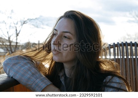 female sensitivity.Gentle girl.Close-up portrait of a woman.Emotions of calmness and sadness.Long hair blowing in the wind.Sensual.woman dreaming and sad.feeling depressed.
tragic state.morbid.
stress