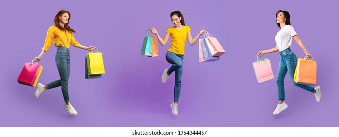 Female Shopping. Full body length shot of three excited diverse women in jeans and t-shirt walking, running and flying with shopper bags, happy about purchase isolated over violet studio background