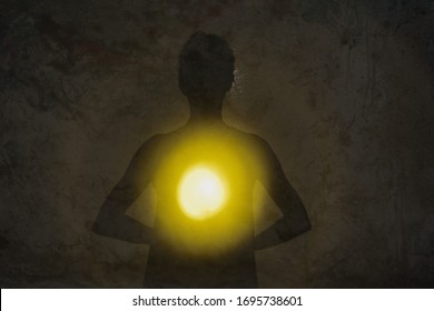 Female Silhouette Radiating Light From Within A Spiritual Heart Opening.