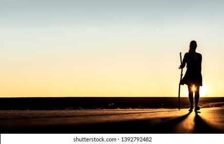 Female silhouette Woman with pilgrim's stick