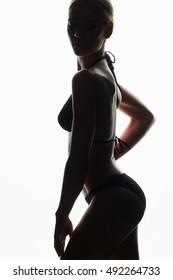 female silhouette.young woman in bikini.girl with a sports body