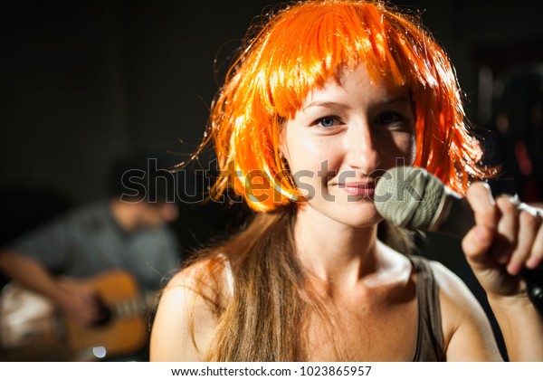 Female Singer Band Wearing Orange Wig Stock Photo Edit Now