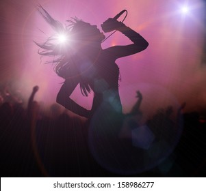 Female Singer Silhouette At Rock Concert