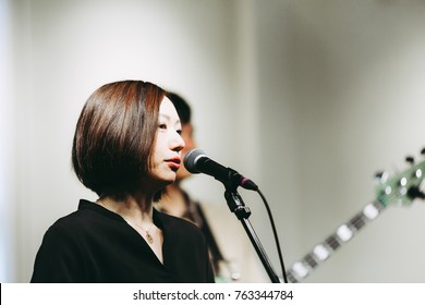 Female Singer Singing On Stage