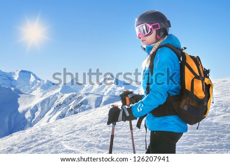 Female skier with beautiful mountain panorama