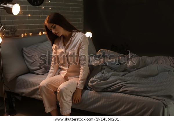 Female sleepwalker in\
bedroom at night