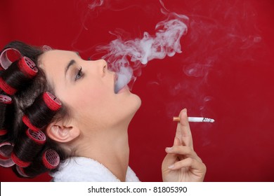 Female Smoker Exhaling Puffs Of Smoke