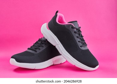 Female Sneakers For Run On Pink Background. Fashion Black Stylish  Running Shoe, Sneaker Or Trainer. Women's Fitness, Sport, Training Concept.