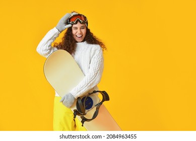 Female Snowboarder On Color Background