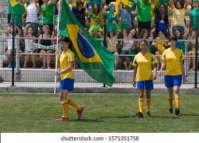 Female soccer player carrying Brazilian Flag - Powered by Shutterstock