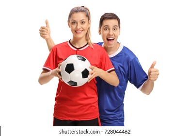 Female soccer player holding a football and a male soccer player holding his thumbs up isolated on white background - Powered by Shutterstock