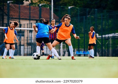 Female soccer players in action during practice at the stadium. Copy space.  - Powered by Shutterstock