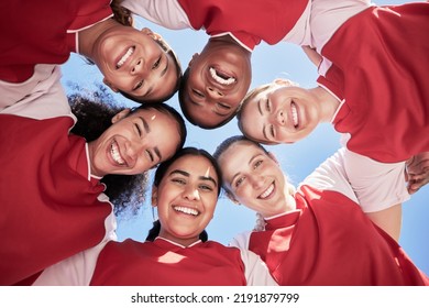 Female soccer team in a huddle smiling in unity and support in a circle. Below portrait of an active and diverse group of women football players or athletes happy and excited for a sports match - Shutterstock ID 2191879799