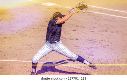 A Female Softball Player Is Pitching The Baseball In Full Windup - Powered by Shutterstock