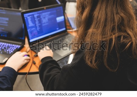 Female software developer students working on computer and laptop, programming contest hackathon competition, pc with coding program app, competitive programming for software engineer